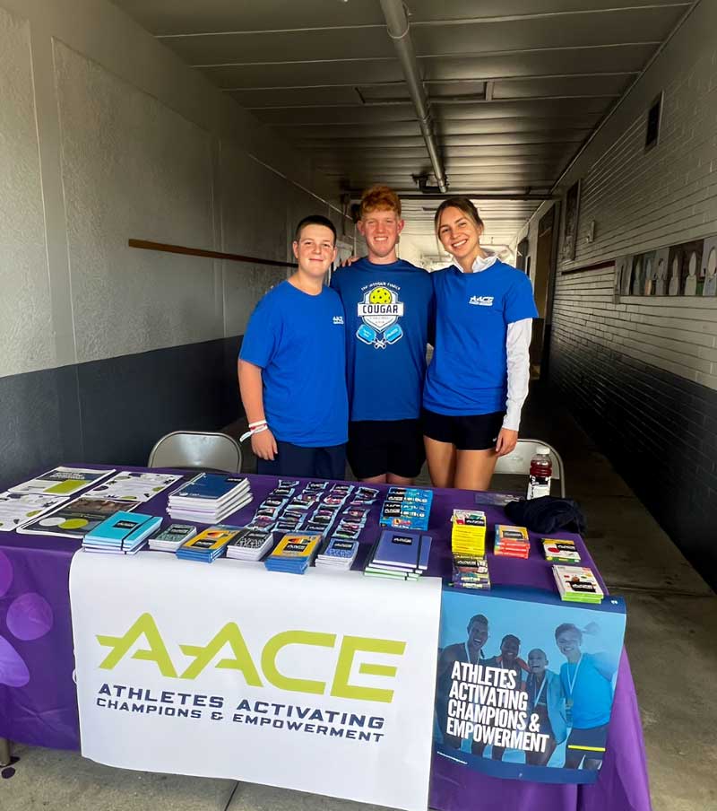 AACE Team standing at their booth